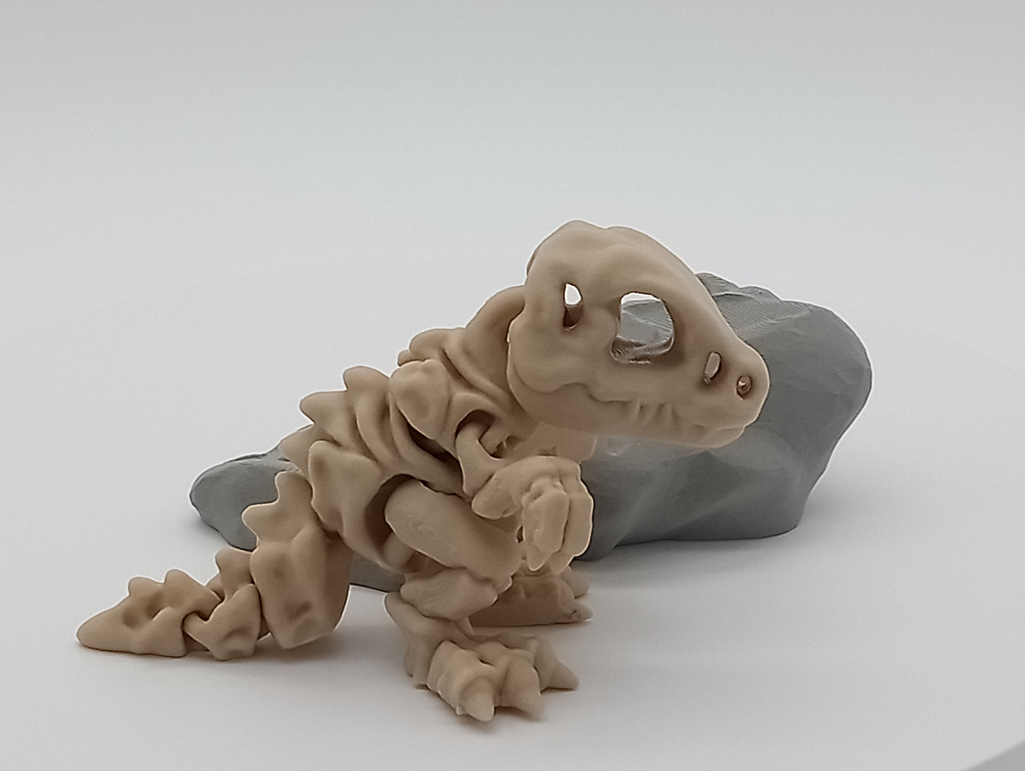 Articulated Tiny Skeleton T-Rex with Rock Stand